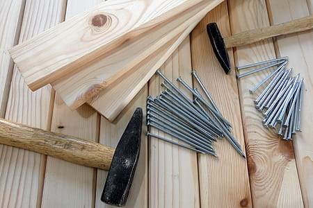 Gray Nails Beside Beige Wooden Planks and Hammers thumbnail