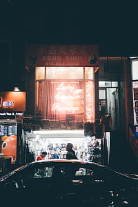 man standing in front Feng Shui store thumbnail