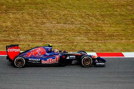 blue and red Renault F1 car on racing field thumbnail