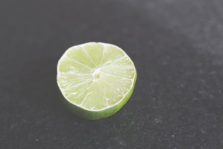 green lemon on black surface thumbnail