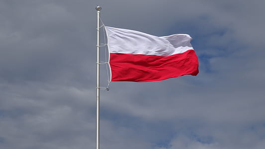 time lapse photography of raised red and white flag thumbnail