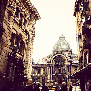 brown concrete building with dome at daytime thumbnail