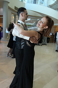 man and woman dancing in white hall thumbnail