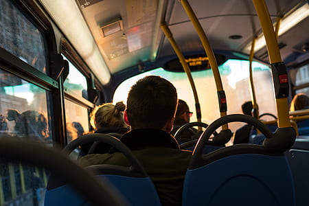 man sitting inside bus thumbnail