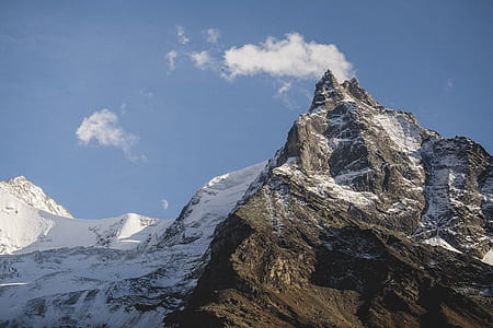 mountain range covered with snow thumbnail
