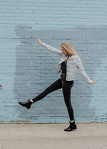woman walking beside wall thumbnail