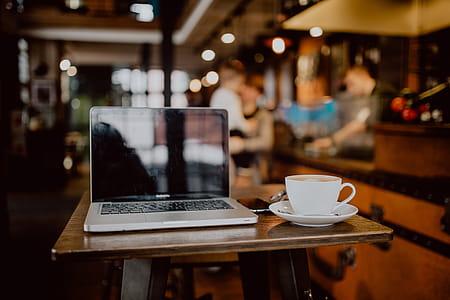 Cup of coffee on table in cafe thumbnail