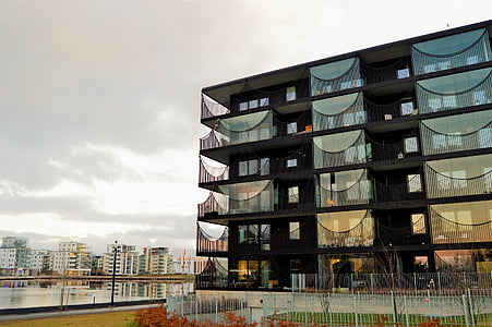 black highrise building near body of water thumbnail