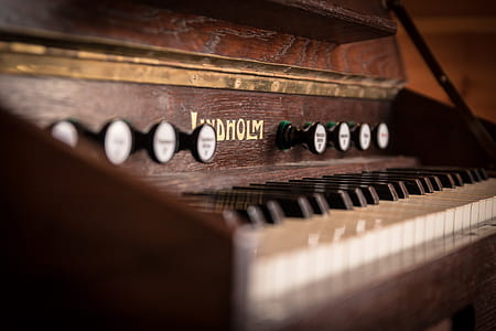 brown upright piano macro photography thumbnail