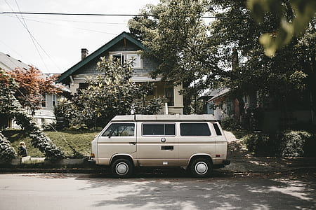 tan van on gray road thumbnail