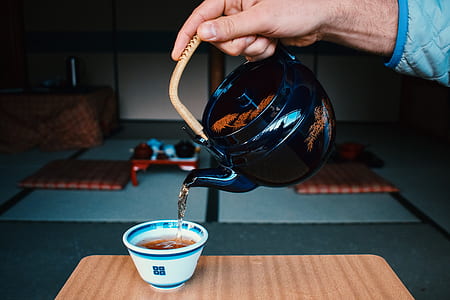 person pouring tea on cup thumbnail