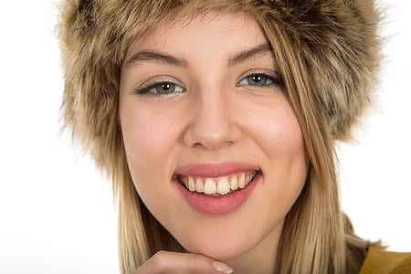 smiling woman wearing brown fur head accessory thumbnail