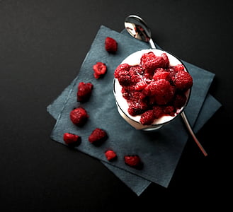 raspberries on white saucer thumbnail