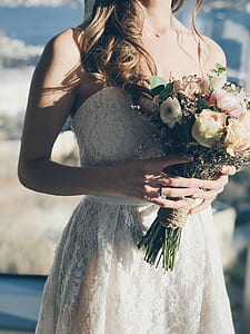 bridge holding bouquet of flowers thumbnail