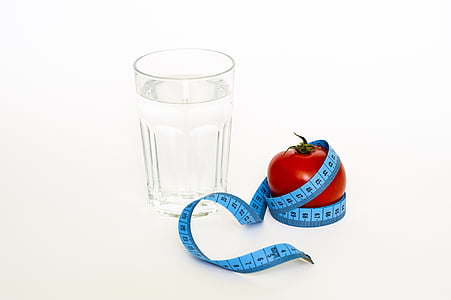 clear drinking glass beside red tomato thumbnail