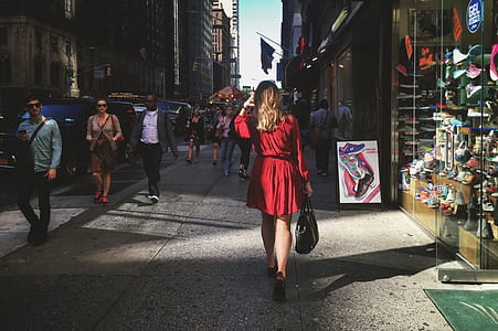 group of people walking near buildings thumbnail