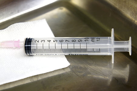 syringe near white tape thumbnail