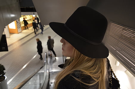 woman wearing black hat inside mall thumbnail