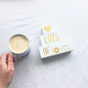 Person Holding White Ceramic Coffee Mug thumbnail