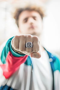 man showing silver-colored mason ring thumbnail