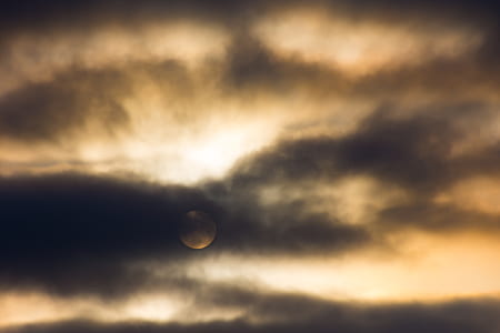 black sky under orange clouds thumbnail