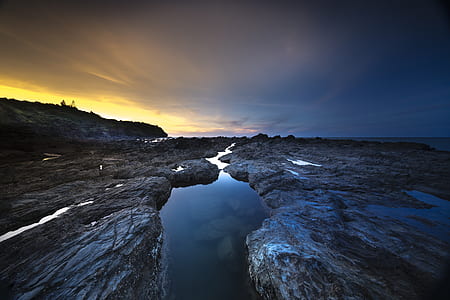 photography of gray stone ground during golden hour thumbnail