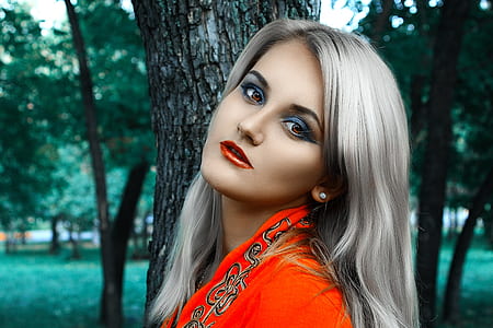 woman wearing red and black top posing for photo thumbnail
