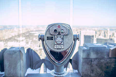 coin operated binoculars on top of a building during daytime thumbnail