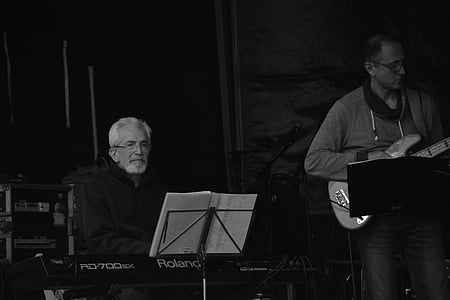 grayscale photo of men playing piano and guitar thumbnail