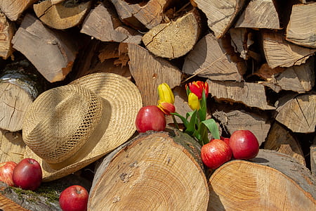 six red apples and brown straw hat thumbnail