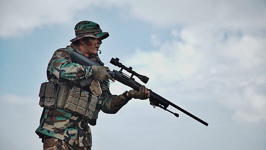 male soldier holding sniper rifle thumbnail