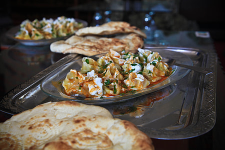 dumplings with sauce on glass plate thumbnail