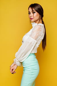 woman in white floral lace long-sleeved dress wearing green fitted bottoms thumbnail