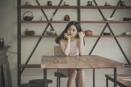 Photography of a Woman Sitting on The Chair Listening to Music thumbnail