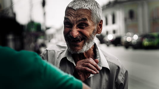 man in grey collared shirt smiling thumbnail