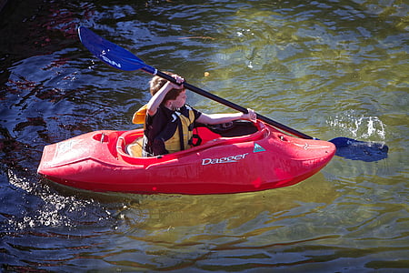boy paddling using red boat thumbnail
