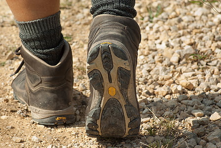 person wearing gray-and-white hiking boots thumbnail