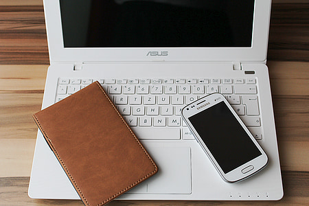 white ASUS laptop with Samsung Galaxy smartphone band brown leather case thumbnail