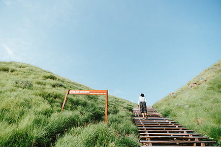 woman walking upstairs on mountain thumbnail