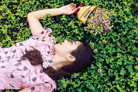 Woman Wearing Pink and Black Floral Blouse thumbnail