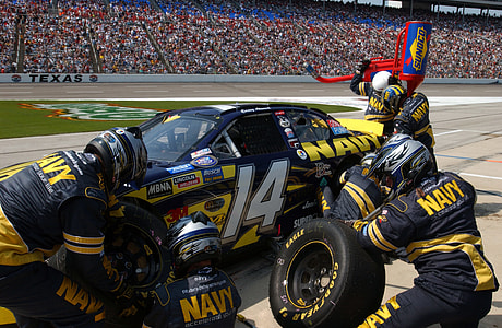 Navy racing car team on pit stop thumbnail
