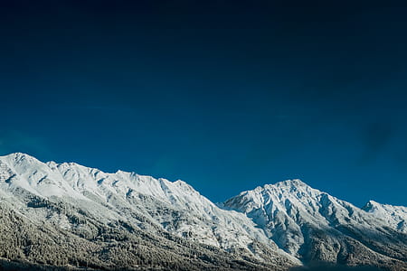 mountain covered by snow at daytime thumbnail