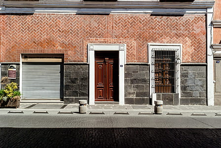 closed brown wooden door during daytime thumbnail