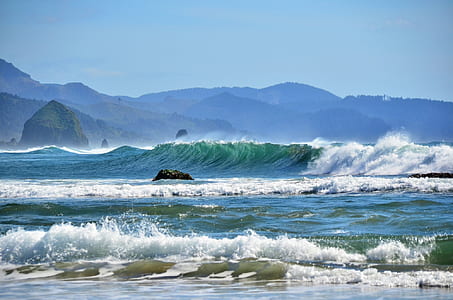 photo of wavy ocean under clear blue sky thumbnail