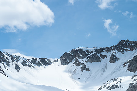low angle photography of mountain covered with snow thumbnail