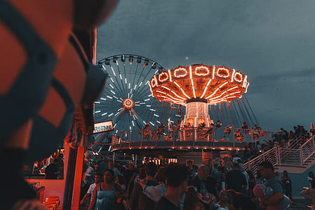 people on amusement park during night time thumbnail