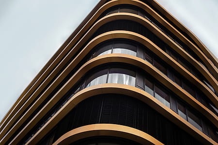 low angle photography of brown concrete building thumbnail