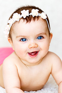 toddler wearing white floral headband thumbnail