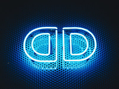 turned on white and blue D neon signage thumbnail