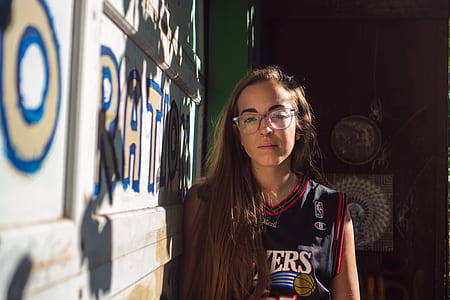 girl wearing black basketball jersey thumbnail